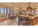 Open kitchen with large island, breakfast nook, and stunning views at 10473 E Greythorn Dr, Scottsdale, AZ 85262