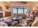 Spacious living room boasts a stunning view and comfortable seating at 10473 E Greythorn Dr, Scottsdale, AZ 85262