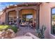 Outdoor patio with fire pit and seating area adjacent to the house at 10473 E Greythorn Dr, Scottsdale, AZ 85262