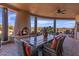 Patio dining area with built in fire place and seating at 10473 E Greythorn Dr, Scottsdale, AZ 85262