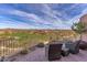 Patio with seating area and breathtaking golf course views at 10473 E Greythorn Dr, Scottsdale, AZ 85262