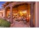 Relaxing patio with fire pit and views of the living room at 10473 E Greythorn Dr, Scottsdale, AZ 85262