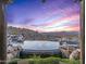 Inviting infinity pool with a waterfall feature and mountain views at 10473 E Greythorn Dr, Scottsdale, AZ 85262