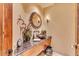 Stylish powder room featuring a granite countertop and decorative mirror at 10473 E Greythorn Dr, Scottsdale, AZ 85262