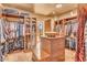 Spacious Primary closet with ample shelving and hanging space at 10473 E Greythorn Dr, Scottsdale, AZ 85262