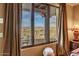 Bedroom with a stunning mountain view from large window at 10473 E Greythorn Dr, Scottsdale, AZ 85262