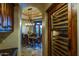 Walk-in wine cellar with ample storage for wine bottles at 10473 E Greythorn Dr, Scottsdale, AZ 85262