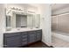 Clean bathroom, featuring a double vanity and shower/tub combo at 10662 N 33Rd Pl, Phoenix, AZ 85028