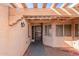 Covered entryway with pergola and wrought-iron gate at 10662 N 33Rd Pl, Phoenix, AZ 85028