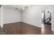 Large room with hardwood floors and space for home gym equipment at 10662 N 33Rd Pl, Phoenix, AZ 85028