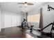 Home gym with elliptical, weight machine, and floor mats at 10662 N 33Rd Pl, Phoenix, AZ 85028