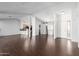 Open living space with hardwood floors, kitchen island, and high ceilings at 10662 N 33Rd Pl, Phoenix, AZ 85028