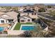Aerial view of house with solar panels and pool, showcasing backyard and neighborhood at 10789 W Yearling Rd, Peoria, AZ 85383