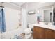 Clean bathroom with double vanity and shower/tub combo at 10789 W Yearling Rd, Peoria, AZ 85383
