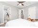 Bedroom with a bed, access to a bathroom, and a view of another room at 10789 W Yearling Rd, Peoria, AZ 85383