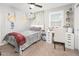 Bright bedroom with carpeted floor, a bed, and a desk area at 10789 W Yearling Rd, Peoria, AZ 85383