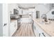 Modern kitchen with white cabinets, granite countertops, and stainless steel appliances at 10789 W Yearling Rd, Peoria, AZ 85383
