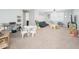 Spacious playroom with seating and ' furniture at 10789 W Yearling Rd, Peoria, AZ 85383