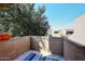 Private balcony with treetop views and striped rug at 10828 N Biltmore Dr # 110, Phoenix, AZ 85029