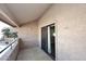 Private balcony with sliding glass door and tiled flooring at 10828 N Biltmore Dr # 115, Phoenix, AZ 85029
