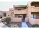 Two-story building exterior with private entrances and balconies at 10828 N Biltmore Dr # 115, Phoenix, AZ 85029