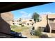 View of the community from a balcony, showing landscaping and buildings at 10828 N Biltmore Dr # 115, Phoenix, AZ 85029