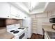 Bright kitchen with white appliances and ample storage at 10828 N Biltmore Dr # 115, Phoenix, AZ 85029