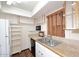 Bright kitchen with white appliances and ample storage at 10828 N Biltmore Dr # 115, Phoenix, AZ 85029