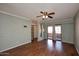 Living room with wood flooring and access to balcony at 10828 N Biltmore Dr # 115, Phoenix, AZ 85029