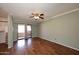 Living room with wood flooring and access to balcony at 10828 N Biltmore Dr # 115, Phoenix, AZ 85029