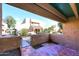 Private patio with tile flooring and gated access to a courtyard at 10828 N Biltmore Dr # 115, Phoenix, AZ 85029