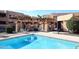 Relaxing pool area with covered seating and inviting blue water at 10828 N Biltmore Dr # 115, Phoenix, AZ 85029