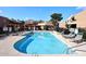 Inviting community swimming pool with lounge chairs for sunbathing at 10828 N Biltmore Dr # 115, Phoenix, AZ 85029