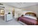 Cozy bedroom featuring patterned wallpaper, and a comfortable bed and furniture at 12087 S Paiute St, Phoenix, AZ 85044