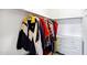 Walk-in closet with coats hanging and white dresser with lots of storage at 12087 S Paiute St, Phoenix, AZ 85044