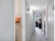 Hallway to secondary rooms that offers well-lit access to bedrooms and bathrooms with neutral wall colors at 12087 S Paiute St, Phoenix, AZ 85044