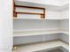 Spacious pantry with ample shelving, providing lots of storage for food and kitchen essentials at 12087 S Paiute St, Phoenix, AZ 85044