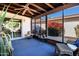 Enclosed screened porch with seating and view of yard at 12087 S Paiute St, Phoenix, AZ 85044
