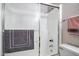 Functional shower with sliding glass doors and neutral color scheme, offering a clean and modern look at 12087 S Paiute St, Phoenix, AZ 85044