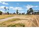 Picture of a street view of a beautiful golf course surrounded by trees at 12087 S Paiute St, Phoenix, AZ 85044