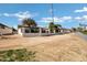 Street view of homes and a neatly maintained golf course and landscaping at 12087 S Paiute St, Phoenix, AZ 85044