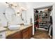 Bathroom boasts dual sinks, granite counters, and walk-in closet at 13026 N 12Th Ave, Phoenix, AZ 85029