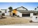 Stunning contemporary home with a clean design and landscaped lawn at 13026 N 12Th Ave, Phoenix, AZ 85029