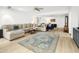 Open living area with large sectional sofa and view to kitchen at 13026 N 12Th Ave, Phoenix, AZ 85029