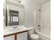 A clean, functional bathroom featuring a shower/tub combo and ample vanity space at 14915 W Port Royale Ln, Surprise, AZ 85379