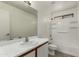 A well-lit, clean bathroom with a shower-tub combo and a single sink vanity at 14915 W Port Royale Ln, Surprise, AZ 85379