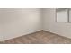 Bedroom features neutral carpet and natural light at 14915 W Port Royale Ln, Surprise, AZ 85379