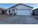 Charming single-story house boasting a well-kept front yard and a convenient two-car garage at 14915 W Port Royale Ln, Surprise, AZ 85379