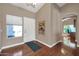 Bright entryway with hardwood floors and access to an office at 14949 W Robson Cir, Goodyear, AZ 85395