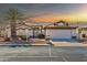 Single-story home with a two-car garage and desert landscaping at 14949 W Robson Cir, Goodyear, AZ 85395